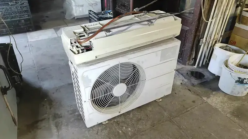 Outdoor air conditioner condenser with text showing 8 to 10 dollars
